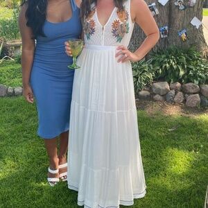 White dress with floral appliqué